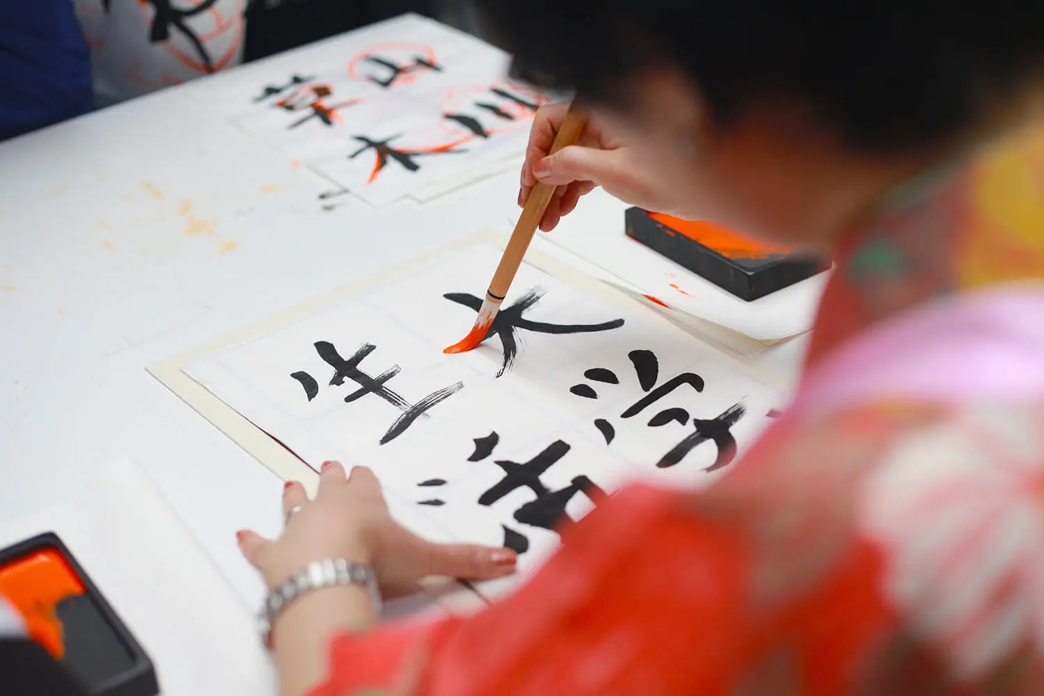 Woman doing Japanese caligraphy